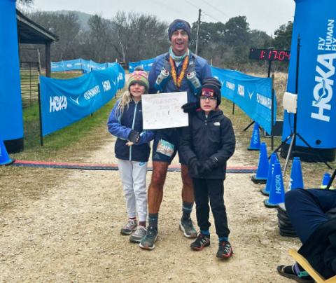 Photo of Matt Robinson and his kids at the end of a race.