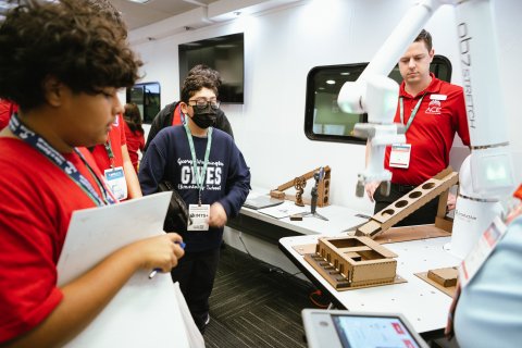 Photo of IACMI staff educating students at IMTS 2024. Photo credit: NIST