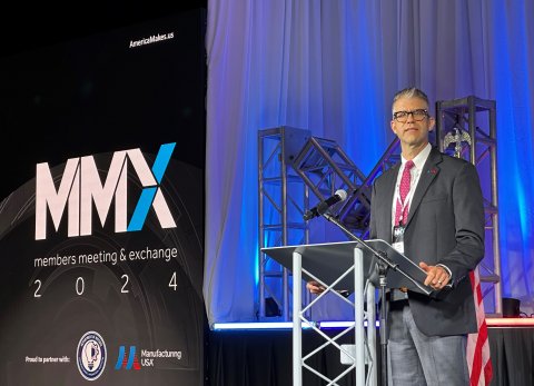 Photo of John Wilczynski speaking at a podium at America Makes' annual members meeting