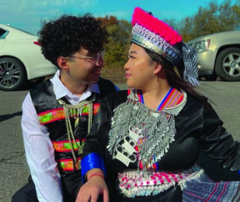 Photo of Oscar Ramirez and his partner, Priscilla Kong. Priscilla is of Hmong descent, with both of her parents having been displaced after the Vietnam War. In this picture, we're celebrating Noj Peb Caug, the Hmong New Year. During the celebration, we wear traditional Hmong clothing to honor the history of the Hmong people and celebrate through food, music, and cultural traditions—an appreciation of what it means to be Hmong.