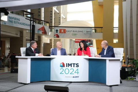 Mike Molnar (NIST), Berardino Baratta (MxD), Christine Longroy (LIFT), and Bernd Raithel (Siemens) on the Main Stage. Photo by IMTS.